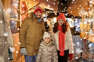 Image showing happy family at christmas market in city