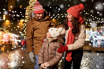 Image showing happy family at christmas market in city