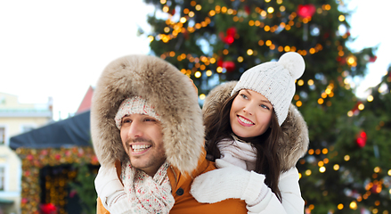 Image showing happy couple over christmas market background