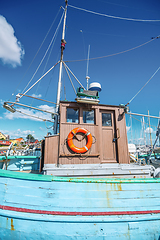 Image showing Retro old fishing boat in a marine harbor