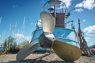 Image showing Fishing boat with a large propeller on land