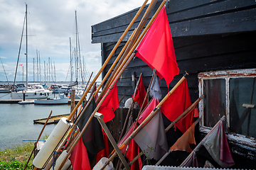 Image showing Red signal flags at a maritime harbor