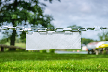 Image showing Blank metal sign hanging on a chain