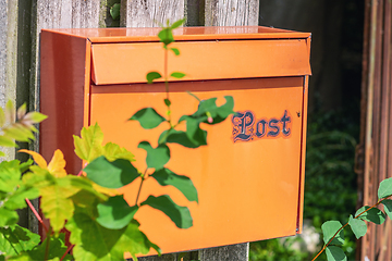 Image showing Retro mail box on a wooden fence