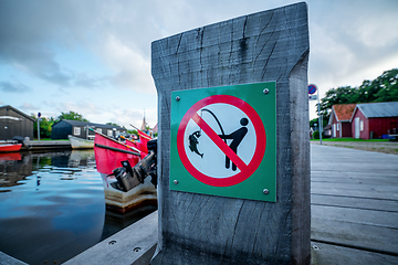 Image showing Fishing prohibited sign on a wooden pier