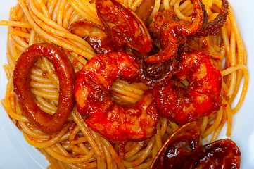 Image showing Italian seafood spaghetti pasta on red tomato sauce