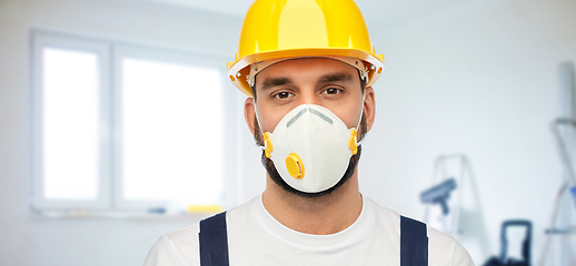 Image showing male worker or builder in helmet and respirator