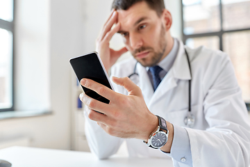 Image showing male doctor with smartphone at hospital