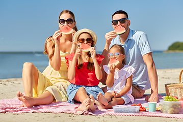 Image showing happy family having picnic on summer beach