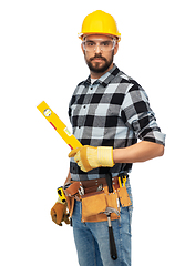 Image showing male worker or builder in helmet with level