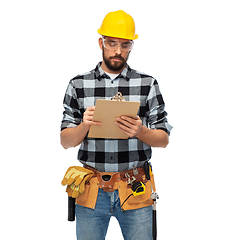 Image showing male worker or builder in helmet with clipboard