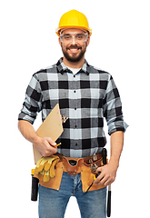 Image showing male worker or builder in helmet with clipboard