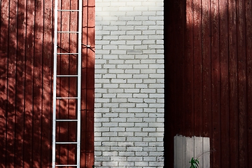 Image showing wood and white brick wall and ladder