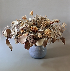 Image showing bouquet of dried flowers in ceramic vase