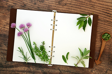 Image showing Fresh Kitchen Garden Herbs with Recipe Book