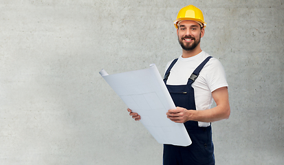 Image showing male worker or builder in helmet with blueprint