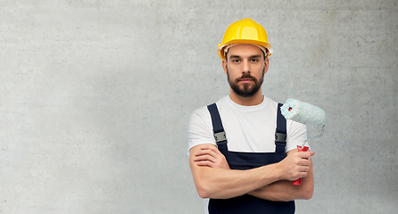 Image showing male worker or builder with paint roller