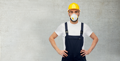 Image showing male worker or builder in helmet and respirator