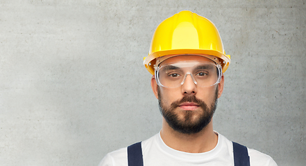 Image showing male worker or builder in helmet and overall