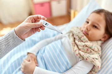 Image showing mother measuring temperature of sick daughter