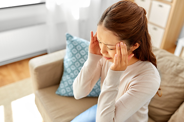 Image showing sick asian woman having headache at home