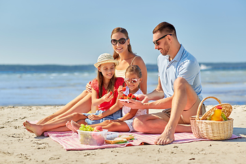 Image showing happy family having picnic on summer beach