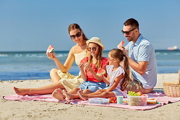 Image showing happy family having picnic on summer beach