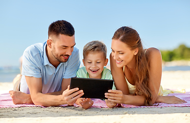 Image showing happy family with tablet computer on summer beach