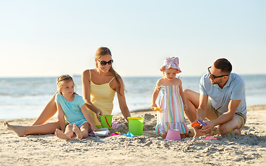 Image showing happy family with daughters on summer beach