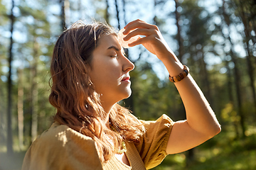 Image showing woman or witch performing magic ritual in forest