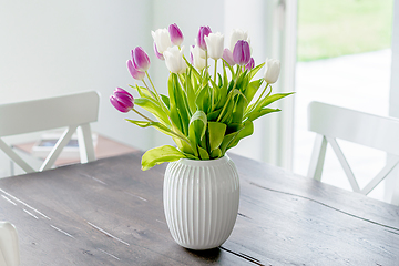 Image showing Bouquet of tulip flowers in a white vase