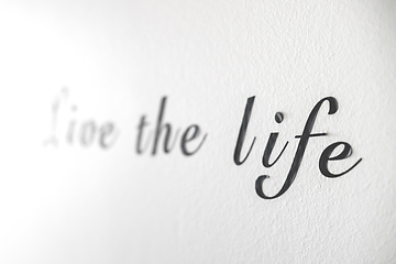 Image showing Live the life word phrase on a white wall