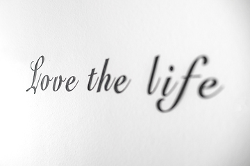 Image showing Love the life word phrase on a bright white wall