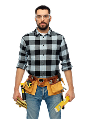 Image showing male worker or builder with tools and level