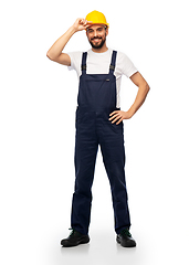 Image showing happy smiling male worker or builder in helmet