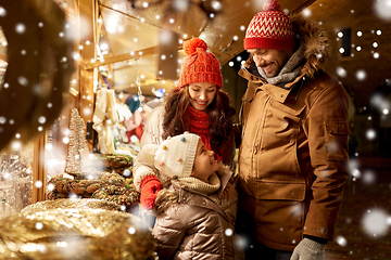 Image showing happy family at christmas market in city