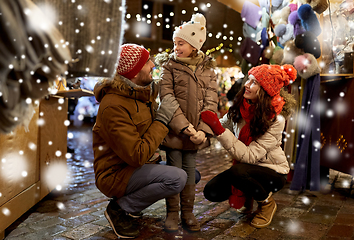 Image showing happy family at christmas market in city