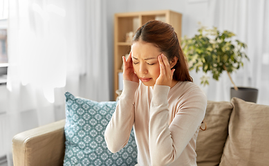 Image showing sick asian woman having headache at home