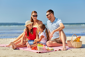 Image showing happy family having picnic on summer beach