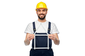 Image showing happy male worker or builder with carpenter's rule