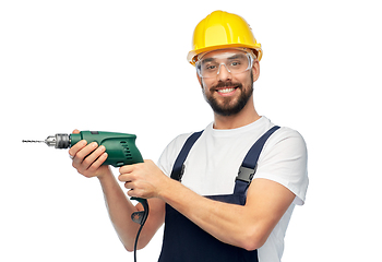 Image showing happy male worker or builder in helmet with drill