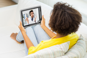 Image showing woman having video call with doctor on tablet pc