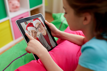 Image showing girl having video call with family on tablet pc