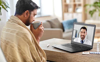 Image showing sick man having video call with doctor at home