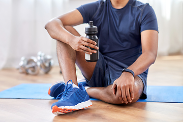 Image showing indian man drinking water after training at home