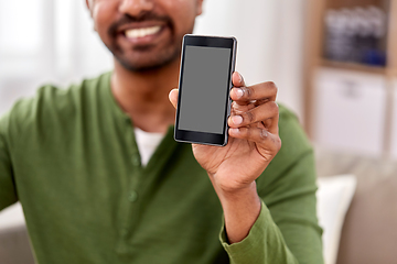 Image showing close up of smiling man showing smartphone at home
