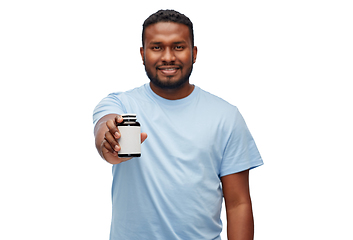 Image showing smiling african american man with medicine jar