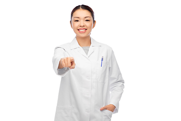 Image showing happy asian female doctor pointing to camera