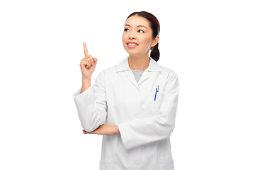 Image showing happy asian female doctor pointing finger up