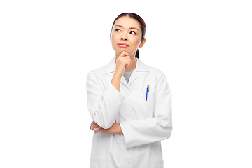 Image showing thinking asian female doctor in white coat